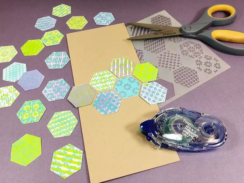 Cut out the hexagons and create a pattern and the attach to the card base with Tombow Adhesive Creatively Beth #creativelybeth #annbutlerdesigns #cards #stencils #hexagons 