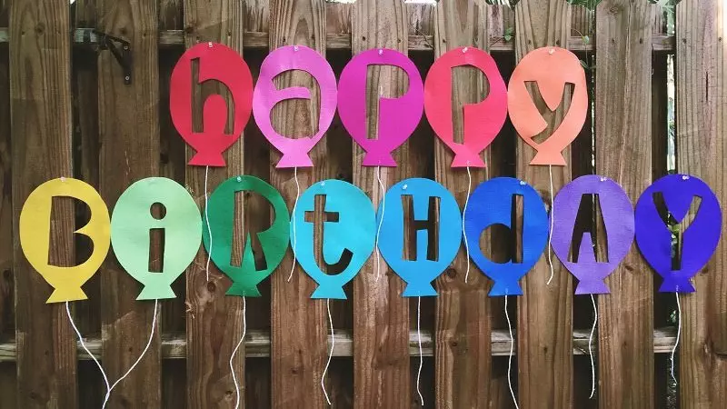Reverse cut brightly colored Kunin Felt to create a Happy Birthday Balloon Banner with Creatively Beth