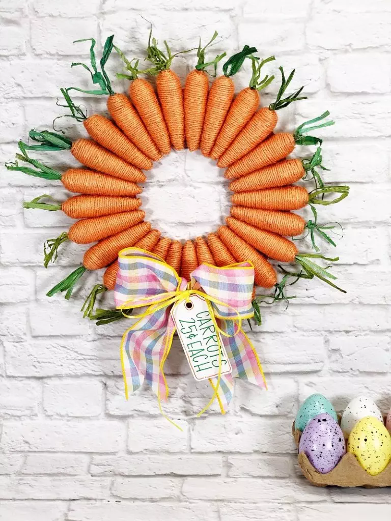 The Sweetest Dollar Tree Carrot Wreath for Easter by Creatively Beth #creativelybeth #dollartreecrafts #easterwreath #dollartreecarrots #springwreath
