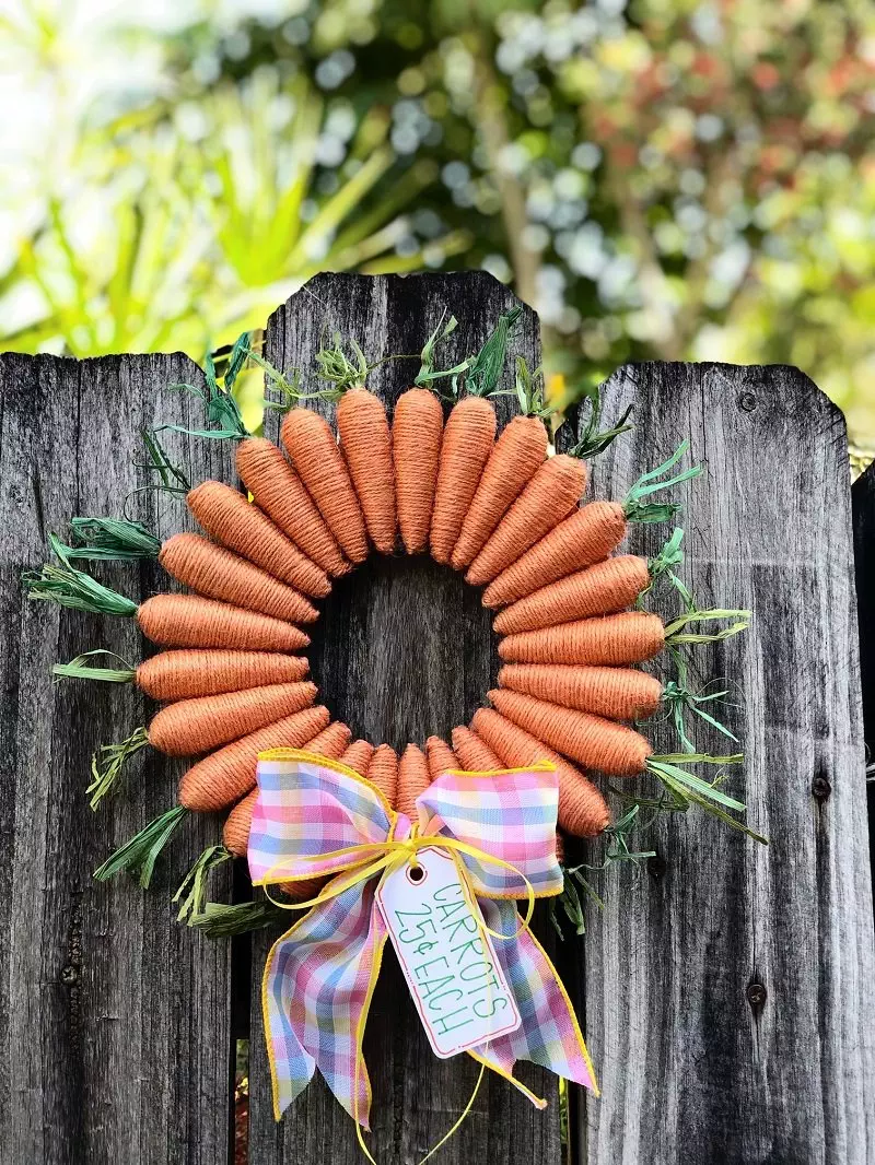 The Sweetest Dollar Tree Carrot Wreath for Easter by Creatively Beth #creativelybeth #dollartreecrafts #easterwreath #dollartreecarrots #springwreath