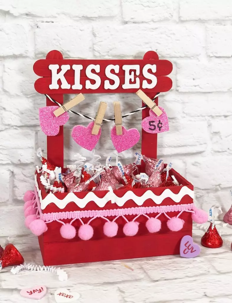 Valentine Kisses Booth Dollar Tree Crafts Creatively Beth #creativelybeth #dollartree #crafts #diy #kissesbooth #kissingbooth #craftstick #popsiclestick #valentine #valentinesday #hersheykisses #kidscraft