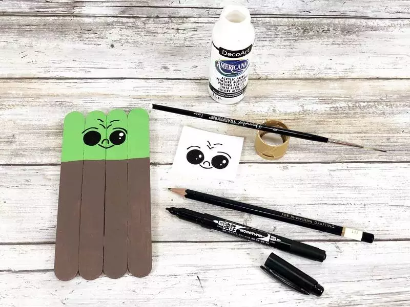 Craft Stick Baby Yoda Grogu Kids Craft Creatively Beth #creativelybeth #babyyoda #grogu #mandalorian #starwars #craftsticks #dollartree #popsiclesticks #diy #freepatterns