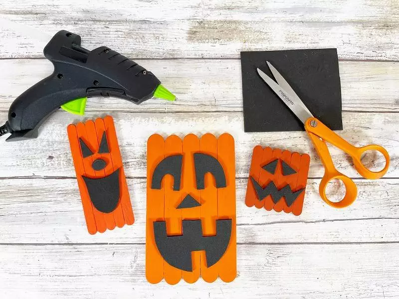 Dollar Tree Craft Stick Halloween Jack-O-Lantern Trio Creatively Beth #creativelybeth #dollartree #diy #craft #kids #pumpkin #jackolantern #halloween #craftstick #popsiclestick