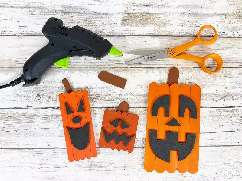 Dollar Tree Craft Stick Halloween Jack-O-Lantern Trio Creatively Beth #creativelybeth #dollartree #diy #craft #kids #pumpkin #jackolantern #halloween #craftstick #popsiclestick