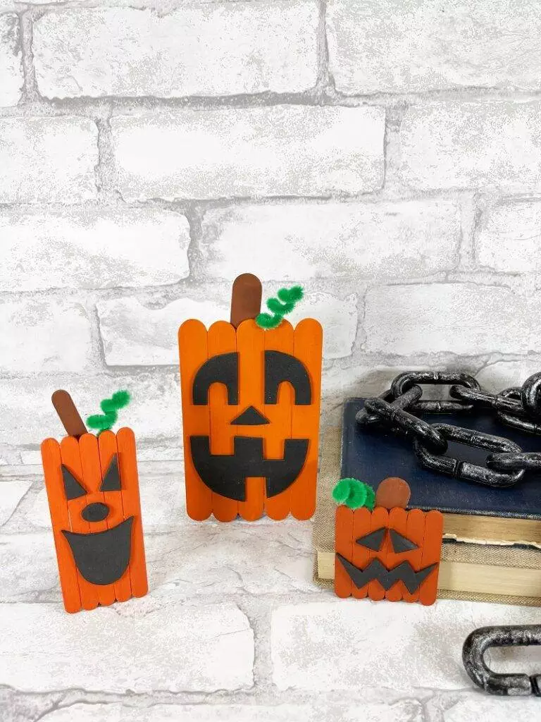 Dollar Tree Craft Stick Halloween Jack-O-Lantern Trio Creatively Beth #creativelybeth #dollartree #diy #craft #kids #pumpkin #jackolantern #halloween #craftstick #popsiclestick