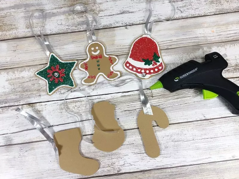 Attach ribbon hangers to Craft Foam Cookies #creativelybeth #dollartreecrafts #christmascookies #kidscrafts